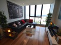 Modern decor, light, quality furniture, wood flooring throughout